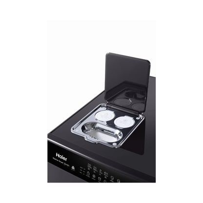 Close up view of the Haier 15/9kg washer dryer combo detergent dispenser, located on the top panel on the left side.