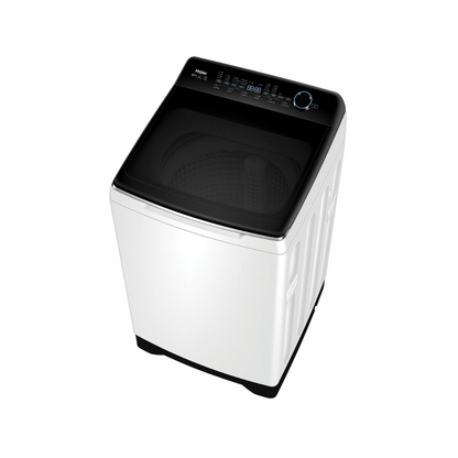 Top angle view of the Haier 12kg top load washing machine in a white finish with the lid closed, showing the control panel with an electric rotary control knob, a digital display and LED displays for the selected wash cycle or function.