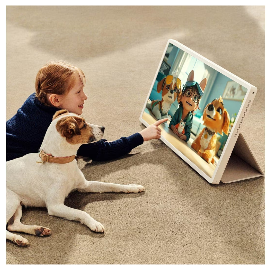 Child interacting with the LG STANDBYME2 showing animated dogs on a carpeted floor