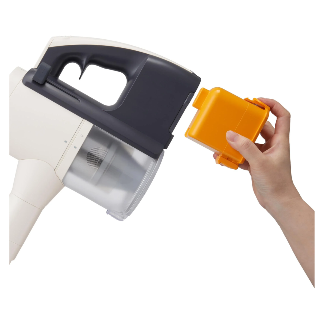 Hand holding an orange battery next to a LG white and black vacuum on a white background