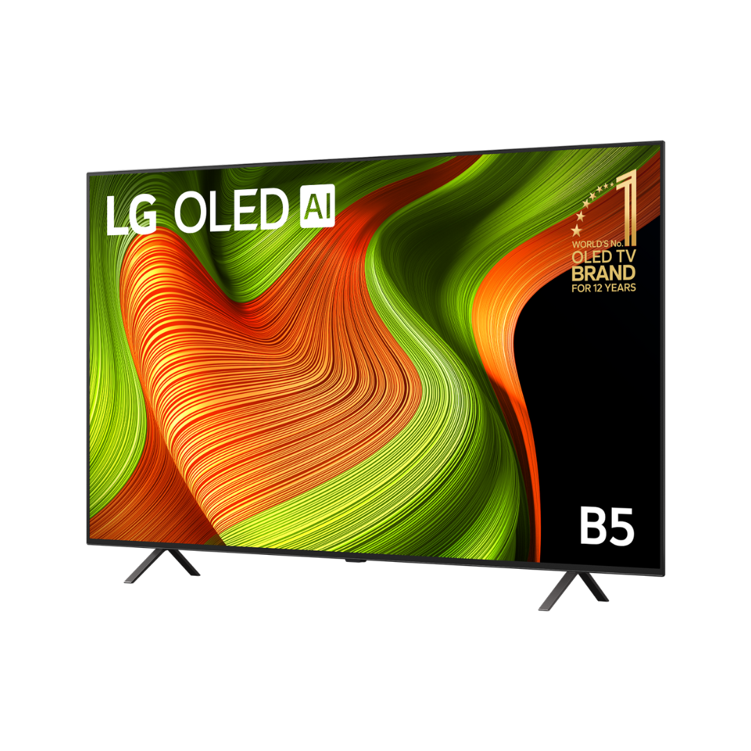 LG B5 OLED AI TV left-angled view displaying vivid orange and green swirls on screen, with sleek bezels and minimalist dual-leg stand design. 