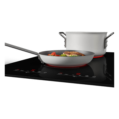 Beko 90cm 5 zone induction cooktop with a pot and pan on different cooktop zones