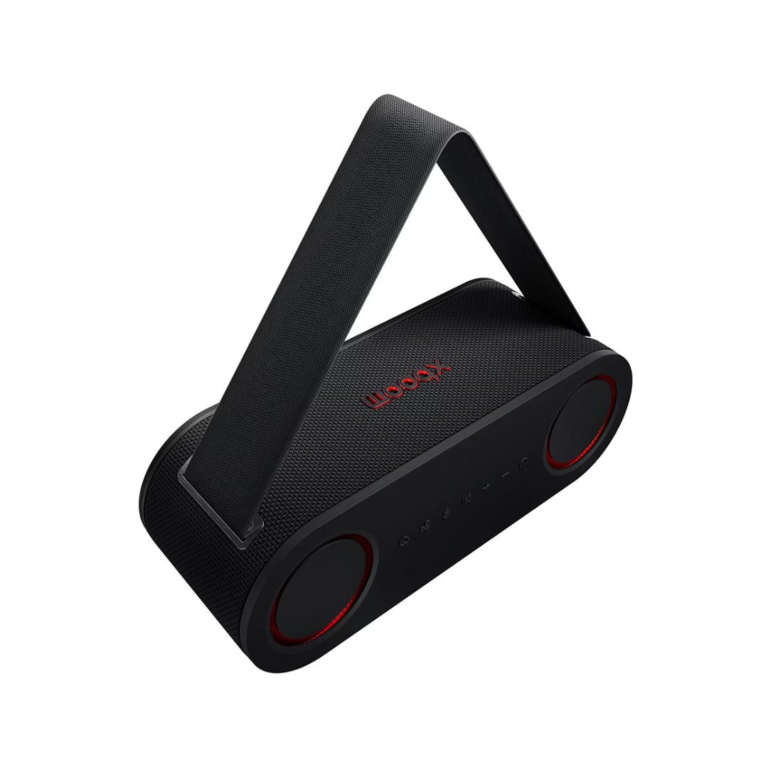 Black LG Bounce xboom portable speaker at an angle show casing it's strap. 