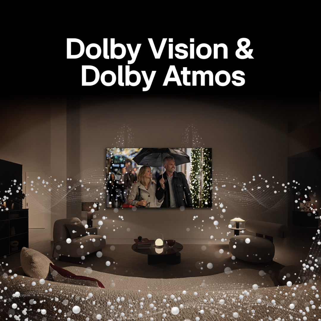 The image depicts a darkened room with a large TV screen showing two people under an umbrella, set up for an immersive viewing experience with ambient lighting and a home entertainment system. The text “Dolby Vision & Dolby Atmos” indicates the TV’s support for these technologies, enhancing audio and visual quality. White sparkles suggest the premium experience provided by Dolby features. This setup is typical for showcasing advanced home theater capabilities.