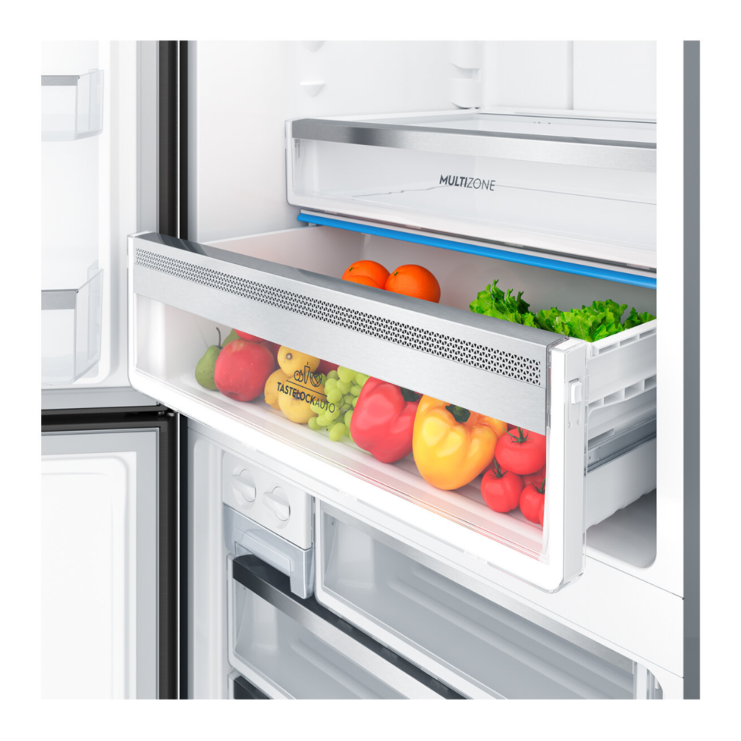 A close up view of the "taste lock auto" draw with fresh produce in it in the Electrolux 496L bottom mount fridge