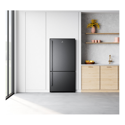 A front view of the Electrolux 496L bottom mount fridge in a dark stainless steel finish in a modern kitchen setting  