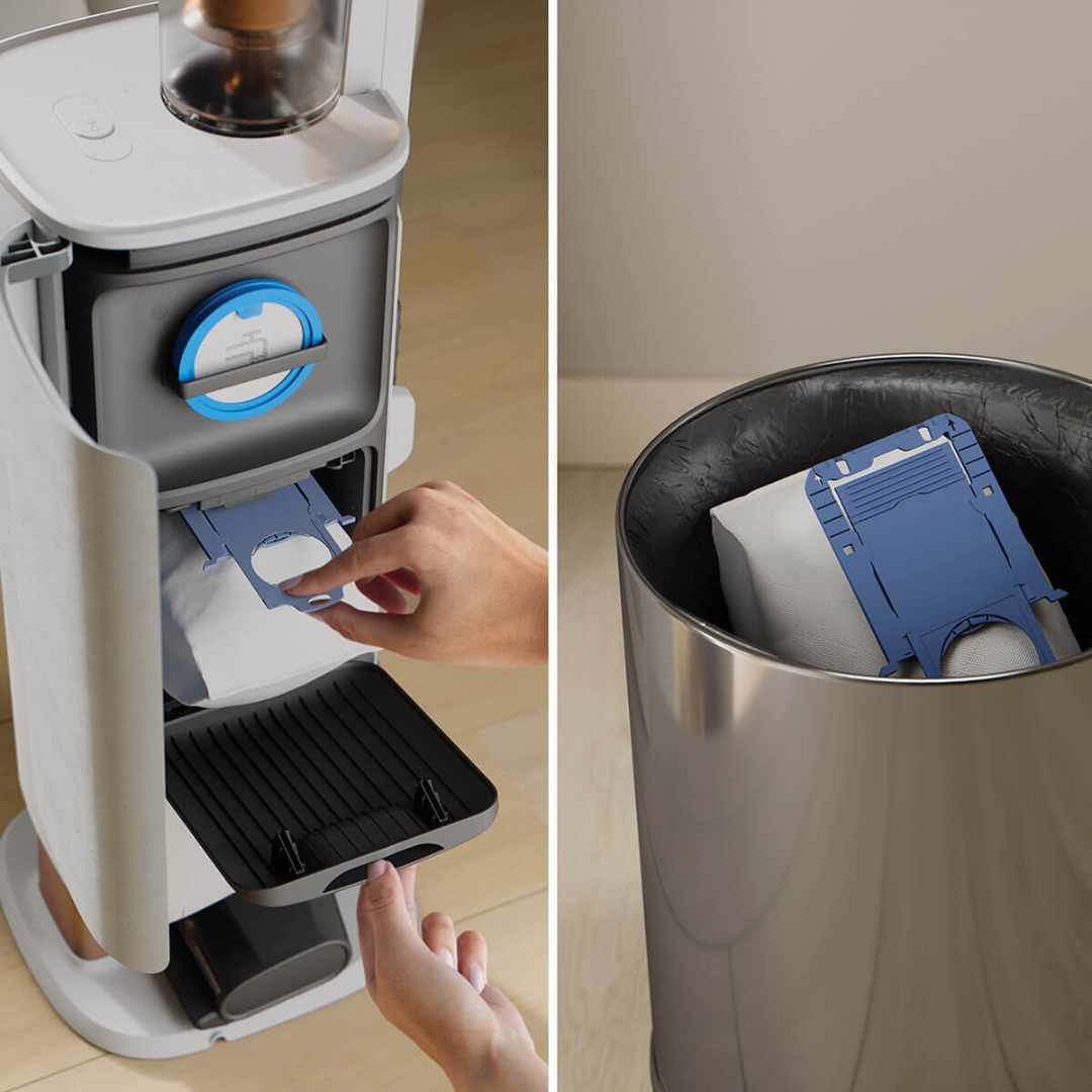 Person disposing the bag from the cleaning station in the Electrolux 800 series cordless stick vacuum with clean station. 