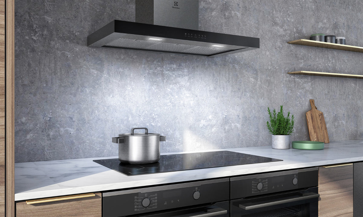 Electrolux Stainless Steel Canopy Rangehood featured above a cooktop on a marble kitchen benchtop