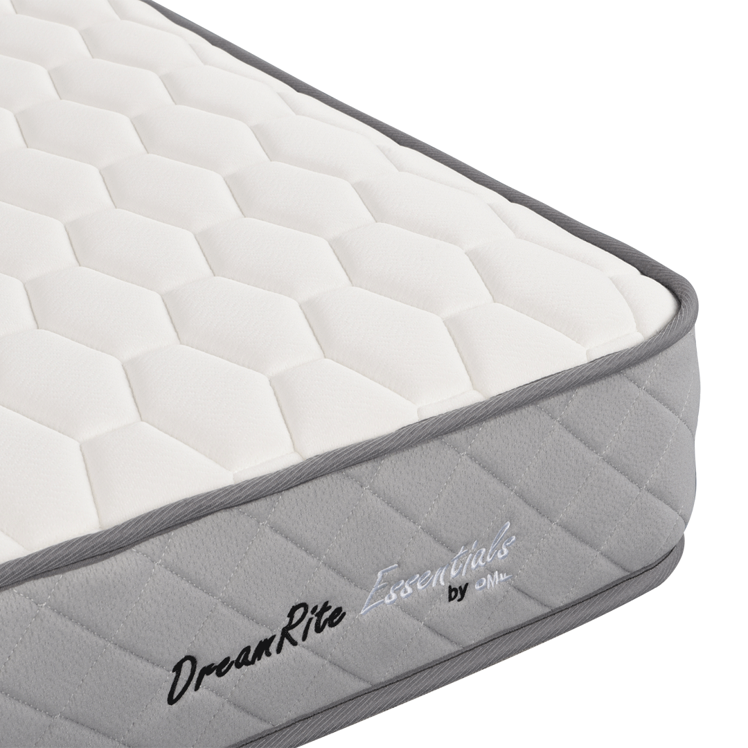 Grey and white mattress with 'DreamRite Essentials' branding on a white background