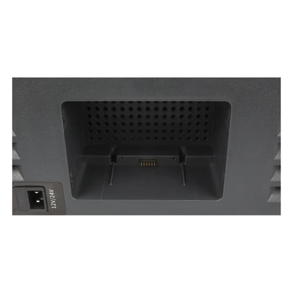 Close-up view of the Brass Monkey dual zone portable fridge/freezer battery compartment with integrated connector pins for removal lithium battery, alongside 12V/24V input socket for vehicle or solar charging.