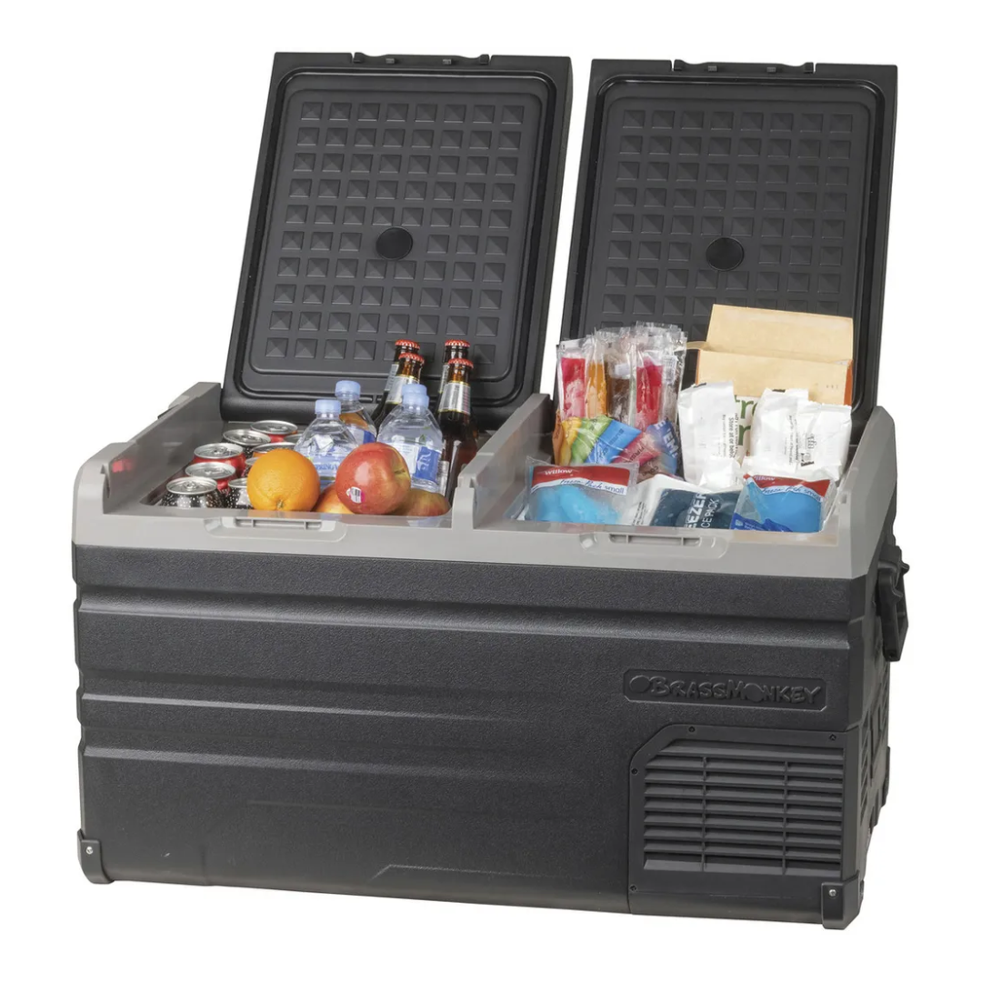 Angle view of Brass Monkey Dual zone fridge/freezer with both lids open, showing stored beverages, fruits, and frozen food, ideal for camping, travel and outdoor adventures. 
