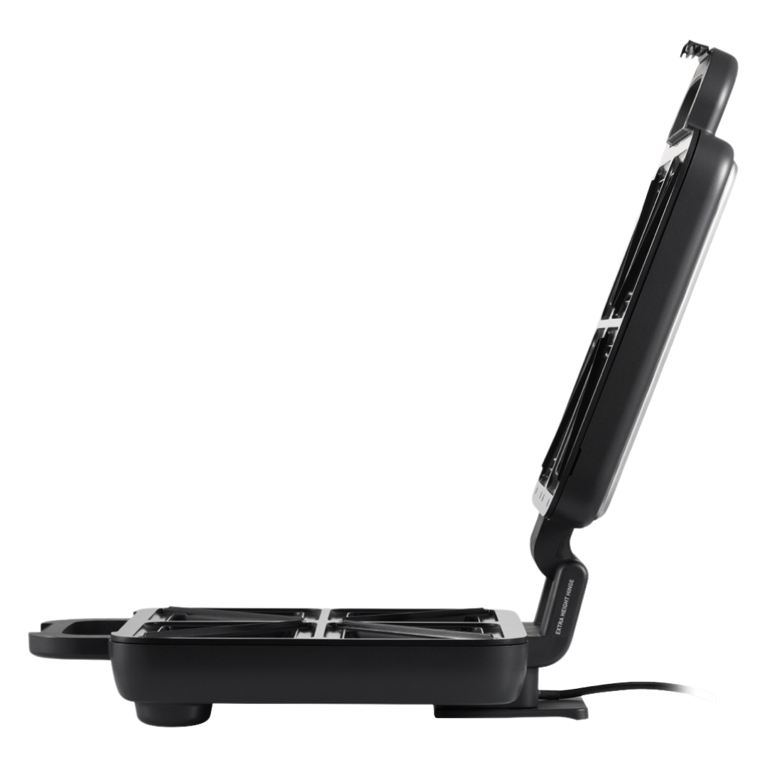 Side view of an open Sunbeam sandwich press showing the non-=stick cooking plates and hinge mechanism, with a visible power cord at the base. 