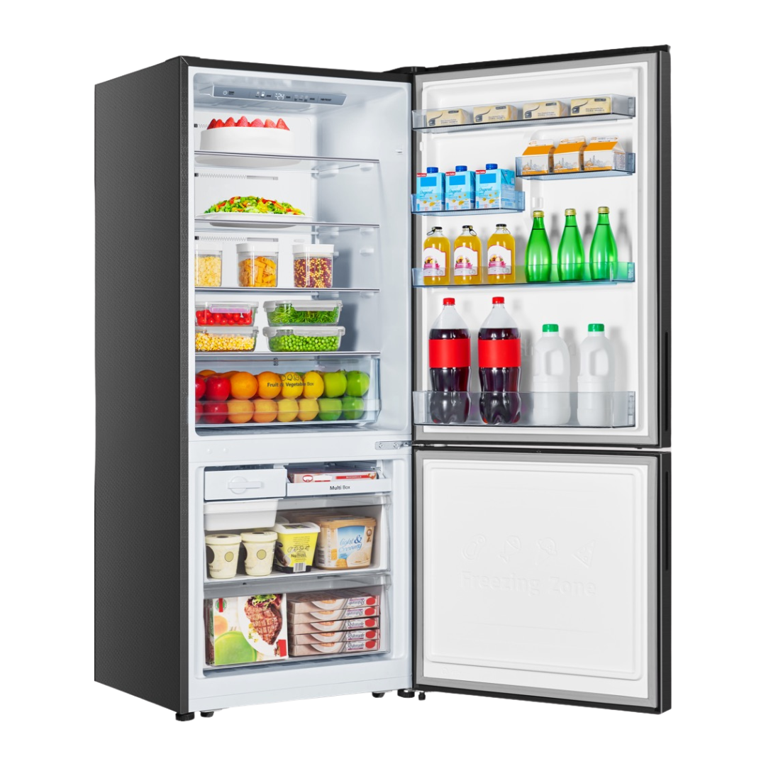 Angled view of the Hisense 417L bottom mount fridge with the doors opened, showing organised shelves, fresh produce draw, door bins and freezer compartment storage.
