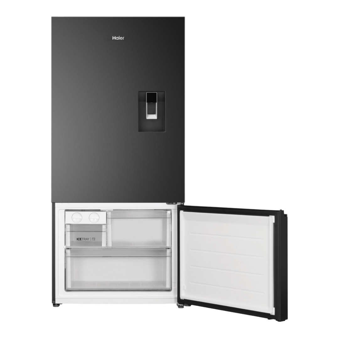 Haier Bottom Mount Fridge with a water dispenser in Black with the freezer compartment open showcasing it's storage capacity
