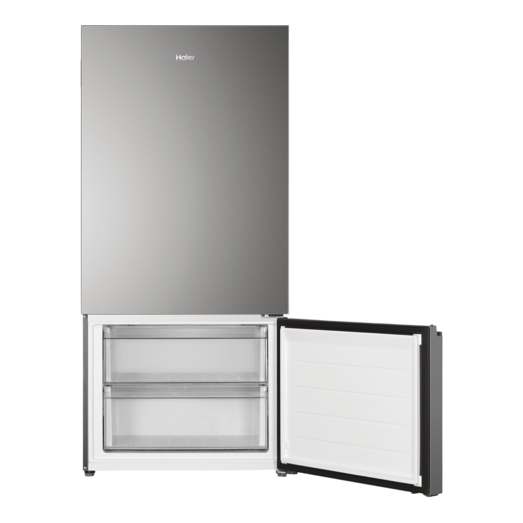 Haier Bottom Mount Fridge in Satina with the freezer compartment open 
