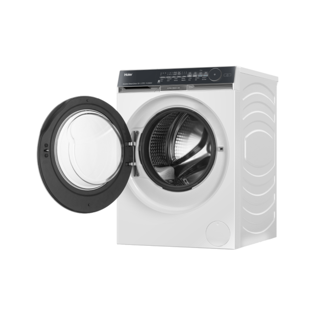White Haier front load washing machine with open door at an angle on a white background