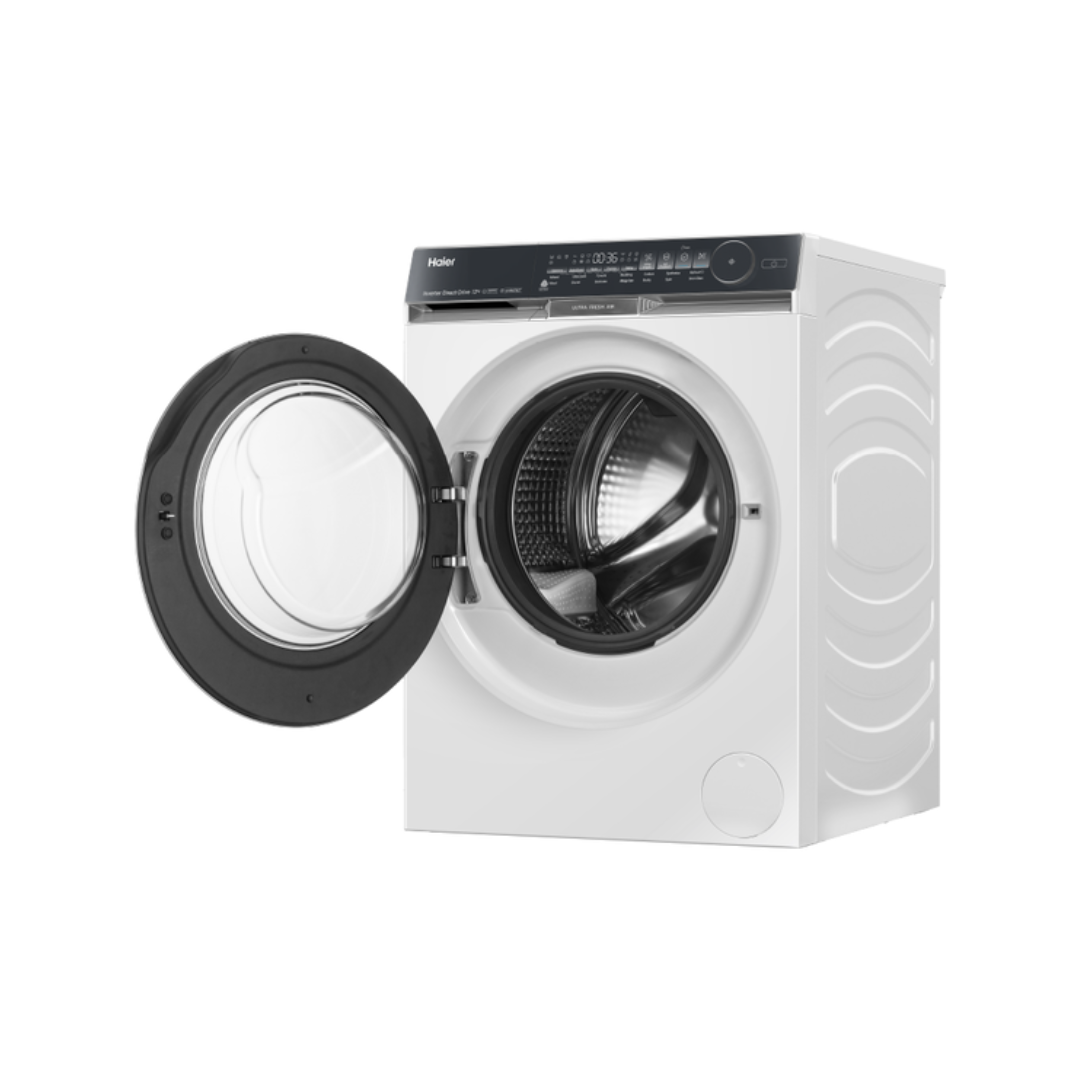 White Haier front load washing machine with open door at an angle on a white background