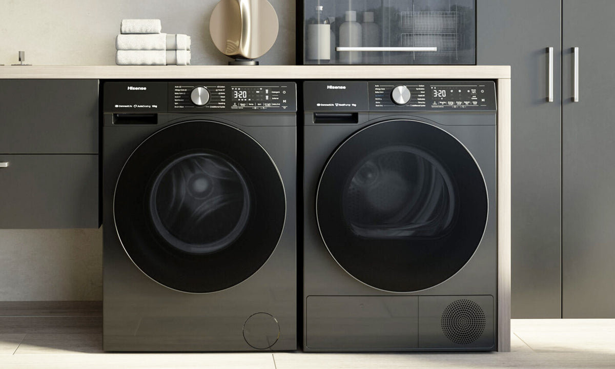Hisense Washing Machine and Dryer pair in dark stainless steel in a laundry room