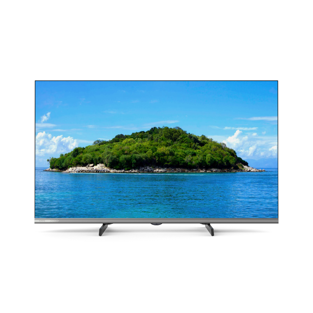 Front view of the Chiq 32" LED HD Google TV, displaying a deserted island, showcasing it's HD display, slim bezels and modern stand design. 