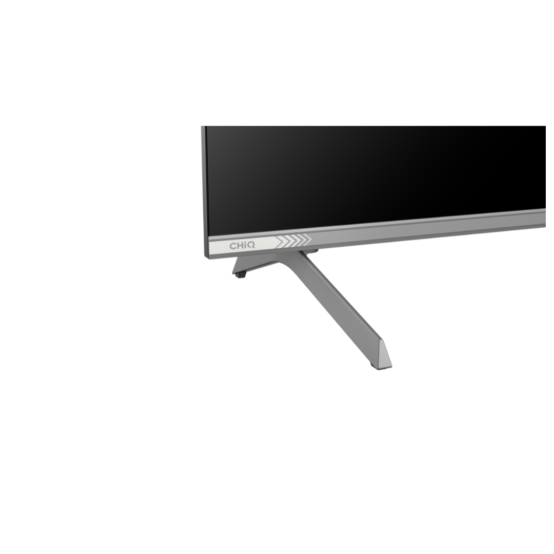 Close up view of a Chiq QLED 4K TV corner, showing the TV legs and the bezels.