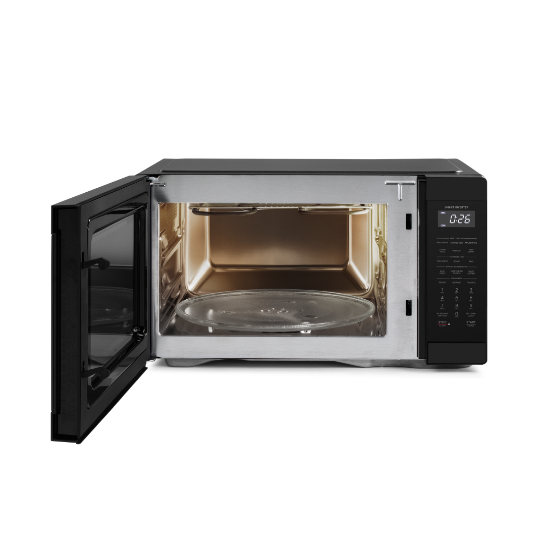 Black Sharp microwave oven with open door with stainless steel interior on a white background