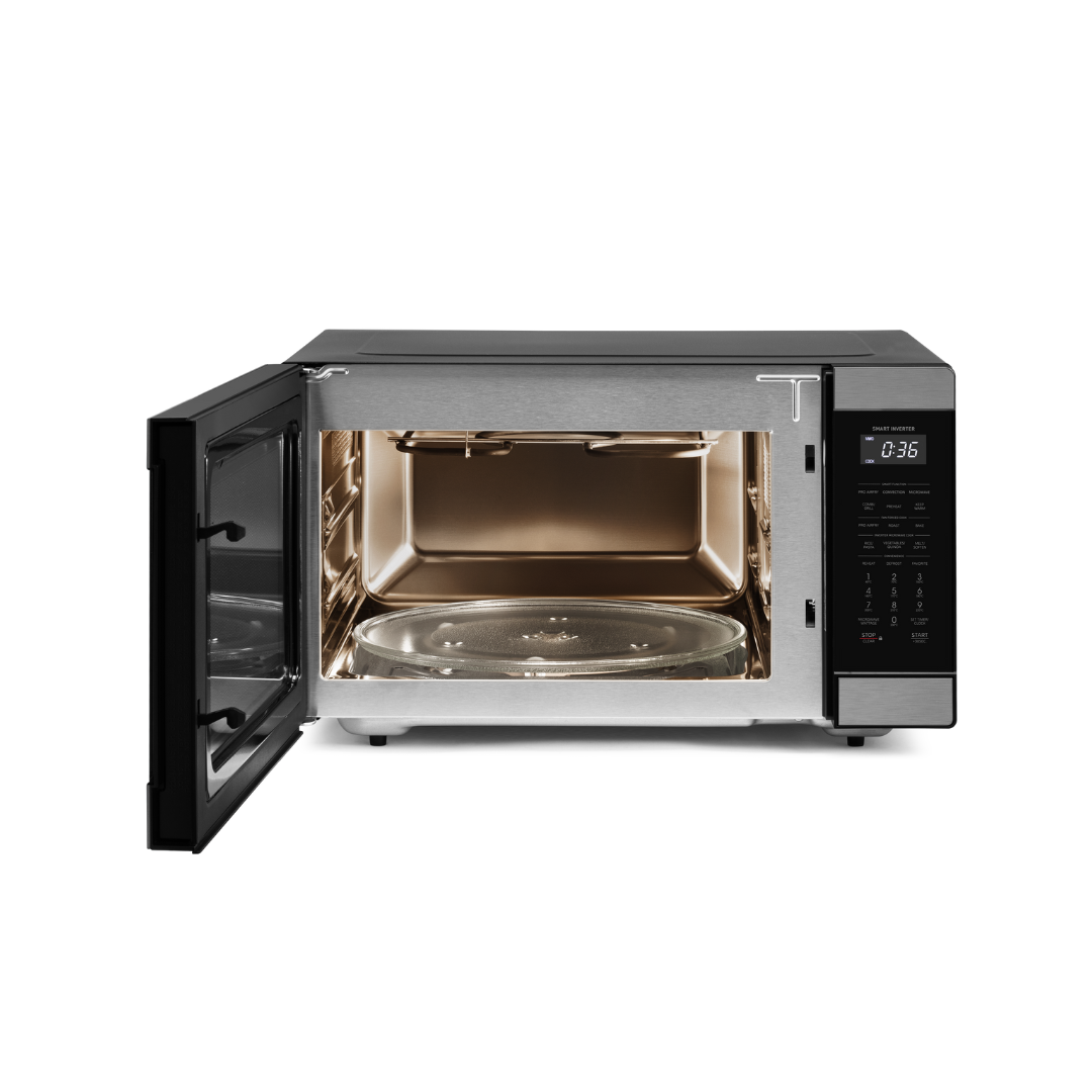 Black Sharp microwave oven with open door and stainless steel interior on a white background