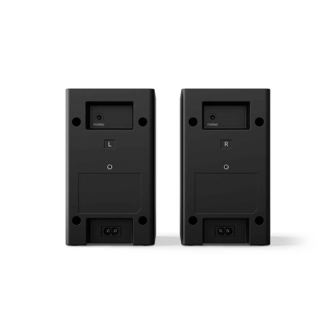 Back view of the LG Home Theater soundbar system rear speakers, showing a pairing LED, left and right indicator and power supply connection. 