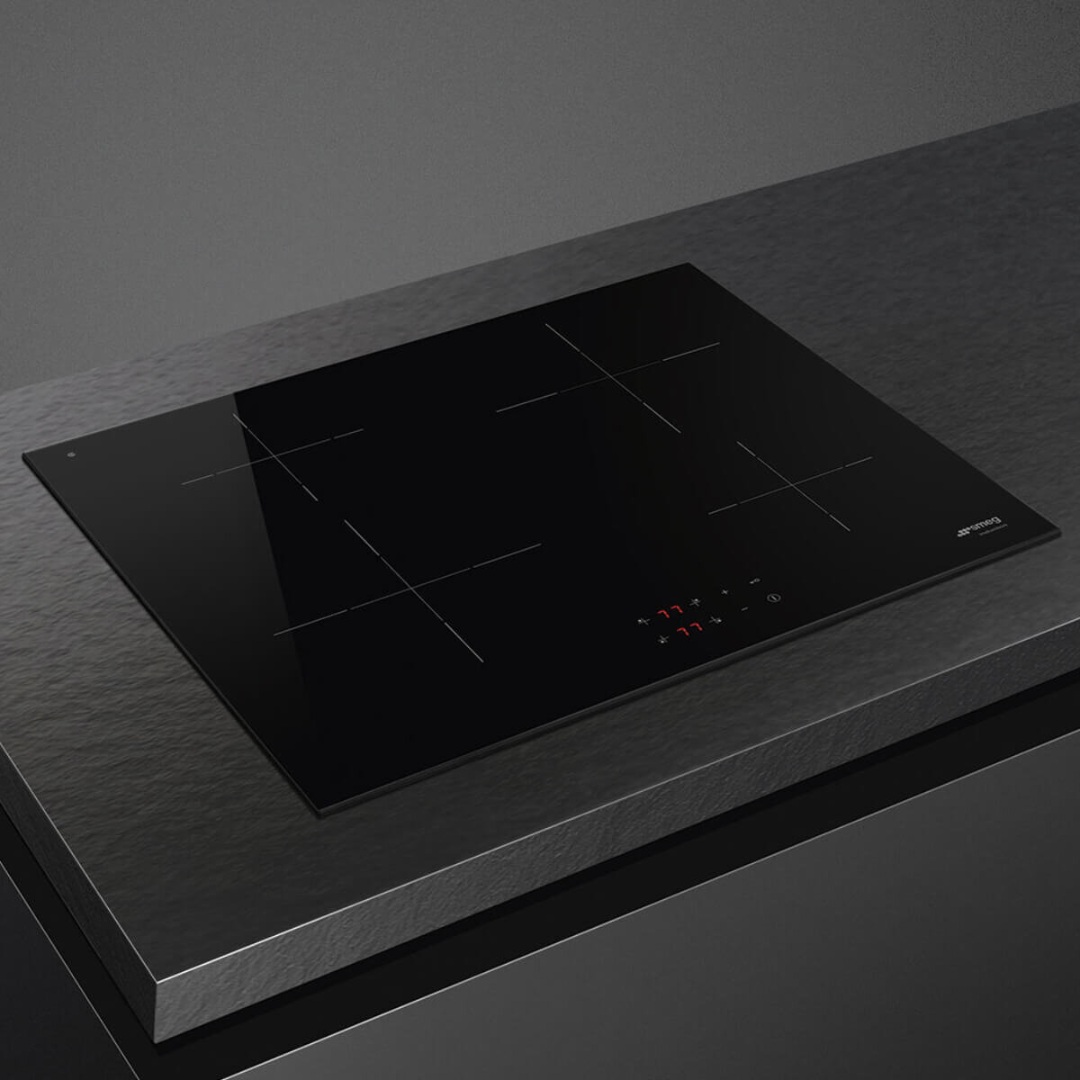 Smeg 60cm Induction Cooktop 4 zone induction cooktop pictured at an angle on a modern counter top