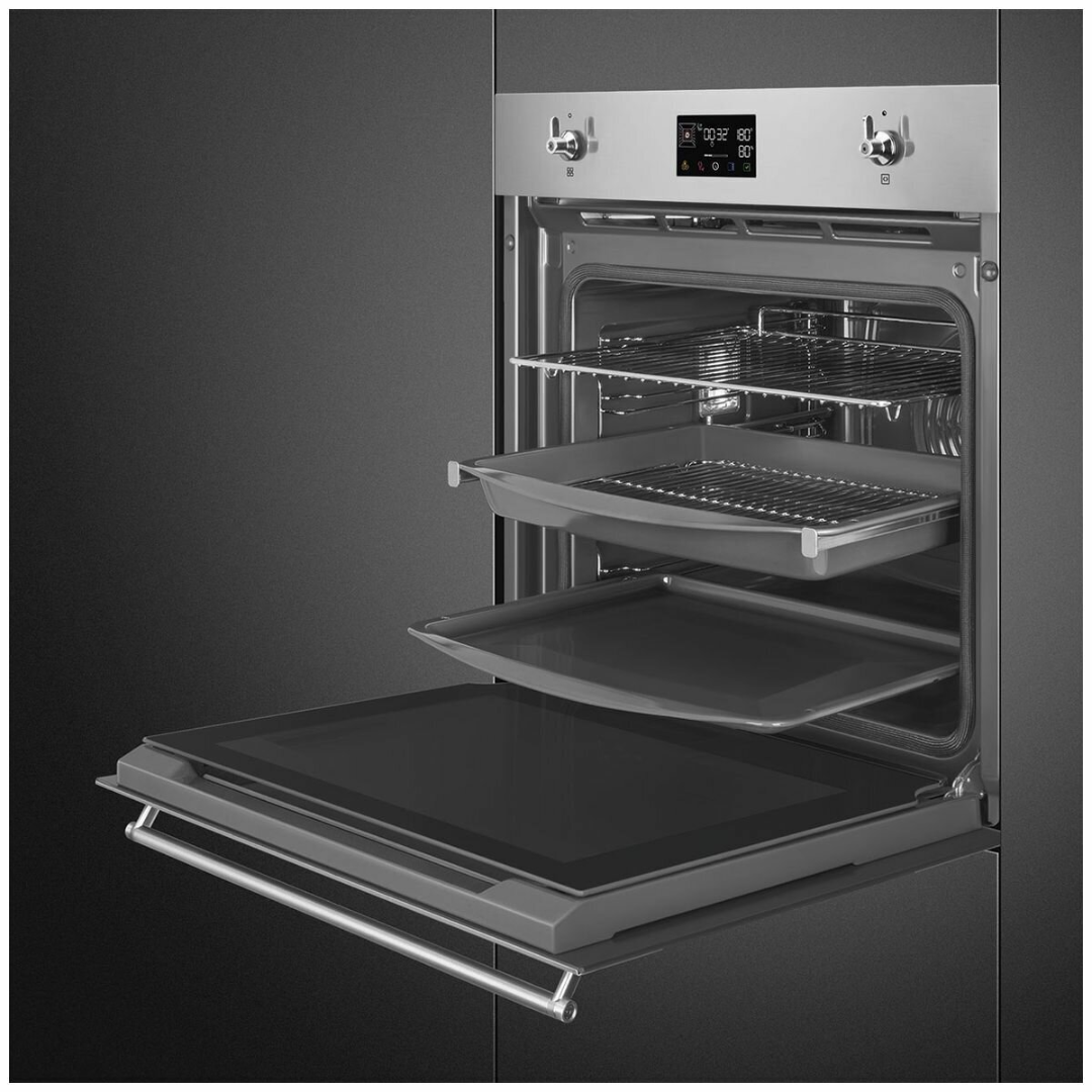 Smeg 60cm Pyrolytic Steam Oven in a stainless steel finish pictured at an angle with the door open and showcasing it's shelves 
