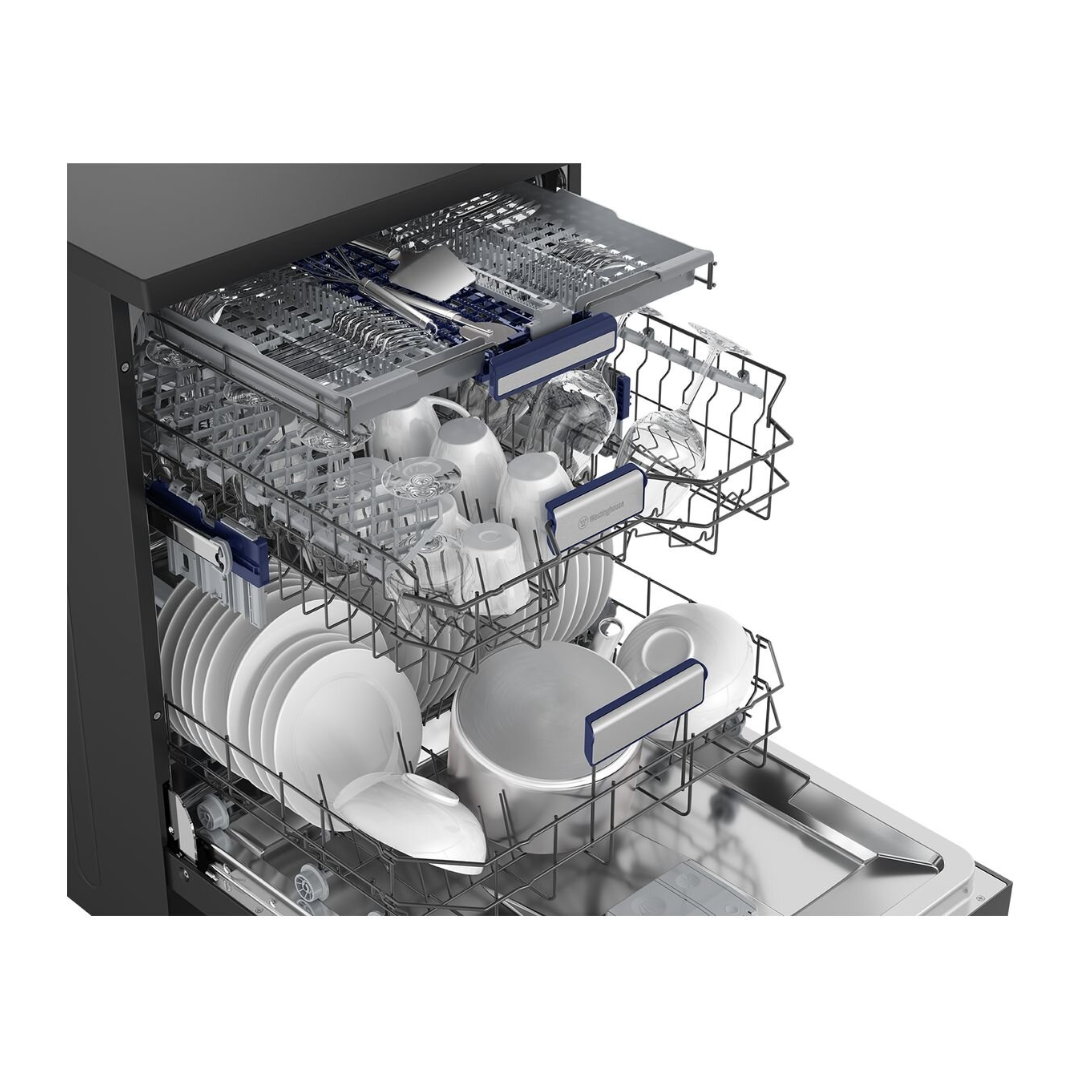 An angled view of the Westinghouse 60cm freestanding dishwasher in dark stainless steel with the door open, reveling the cutlery draw, top and bottom baskets full at capacity.