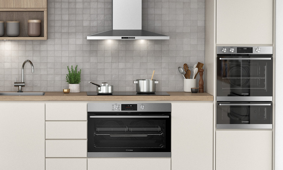 Westinghouse Kitchen featuring stainless steel ovens, in a large 90cm size under the cooktop, and in smaller 60cm sizes on the side