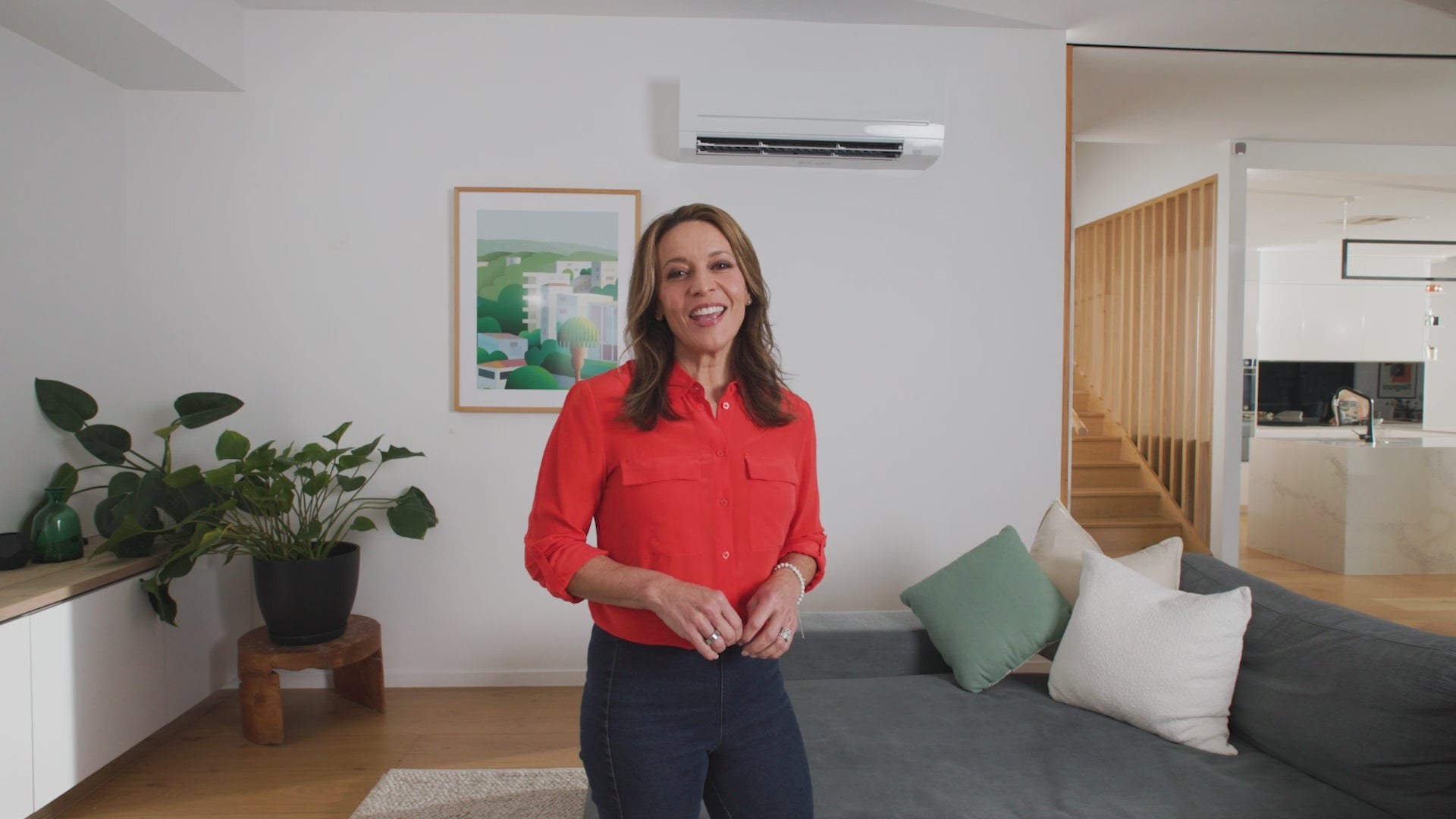 A video of a Mitsubishi Electric air conditioner, in a modern home showing off the app control via Wi-Fi 